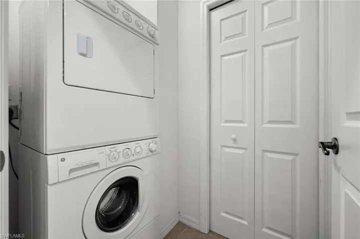 Stacked white washer and dryer unit