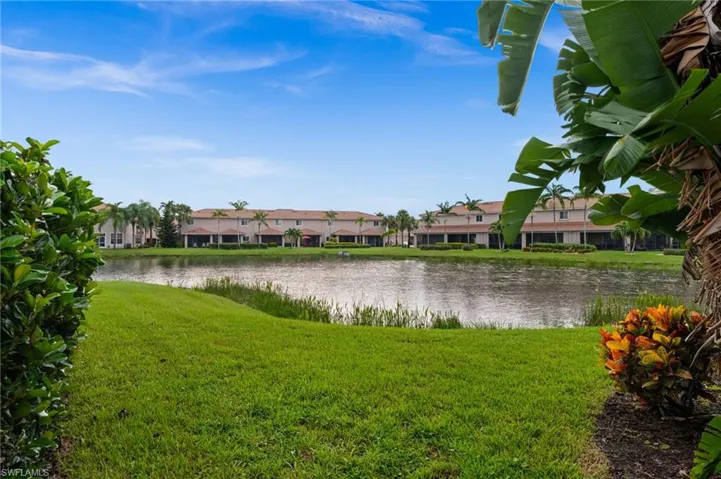 Manicured lawn extending to a tranquil lake