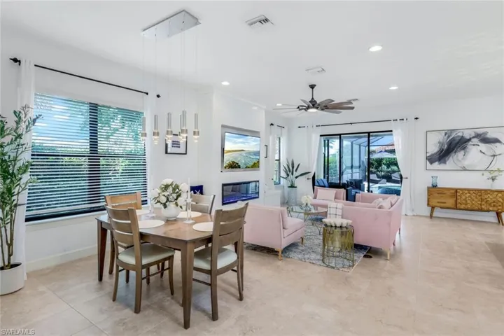 Tiled dining area featuring ceiling fan