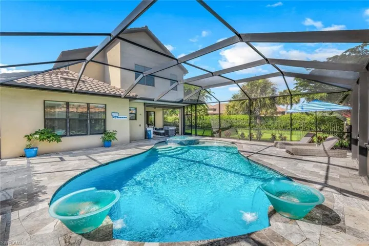 View of swimming pool featuring a patio area, pool water feature