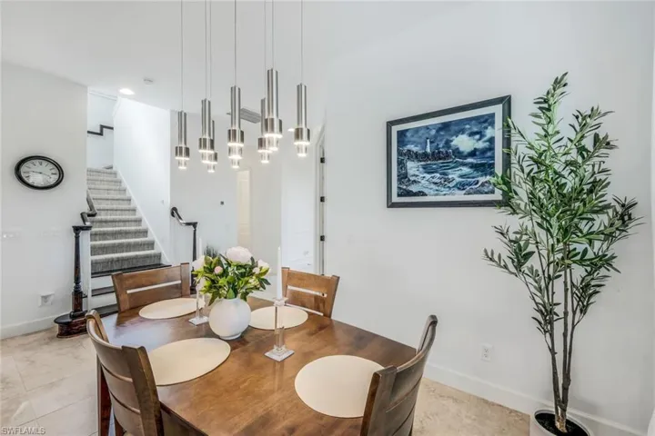 Dining area featuring light tile patterned flooring