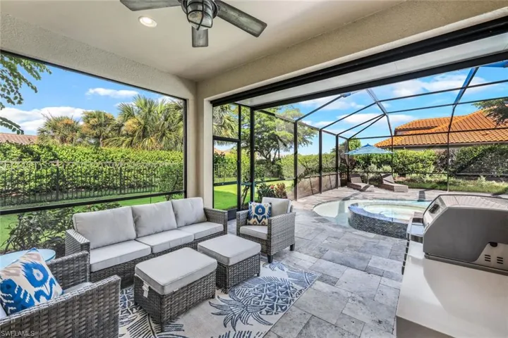 Sunroom featuring ceiling fan