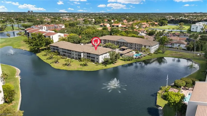 Drone / aerial view of a large body of water and a golf course