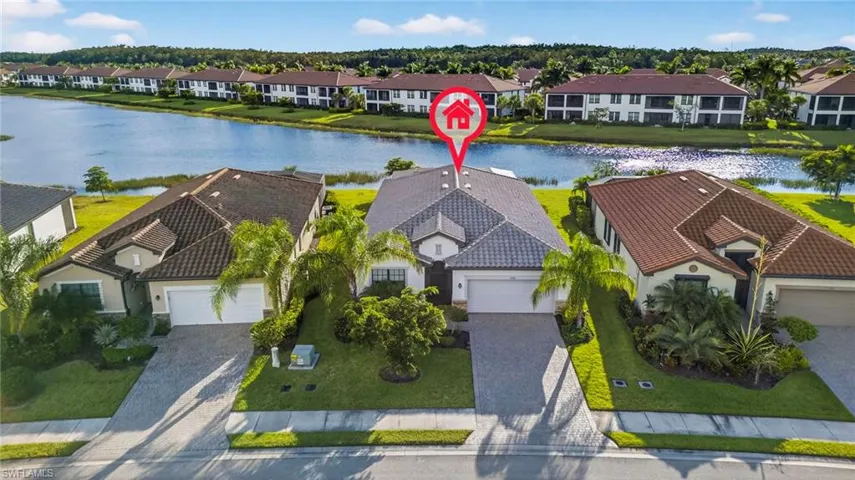 Aerial perspective of suburban area with a nearby body of water
