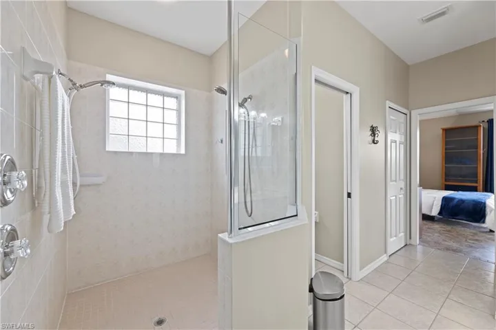 Large Party Shower with dual shower heads and Private Water Closet.