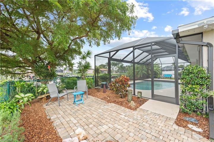 Left Side of Lot Seating area under Shade Tree, Fenced with gate & Paver Walkway