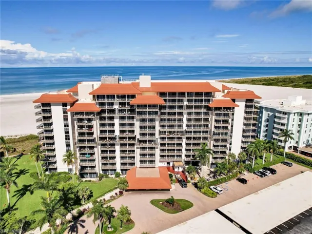 View of property with a water view