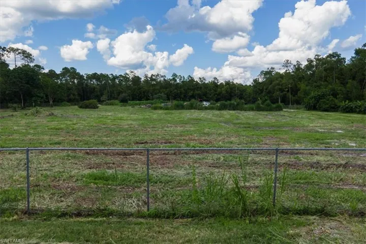 View of yard with a rural view