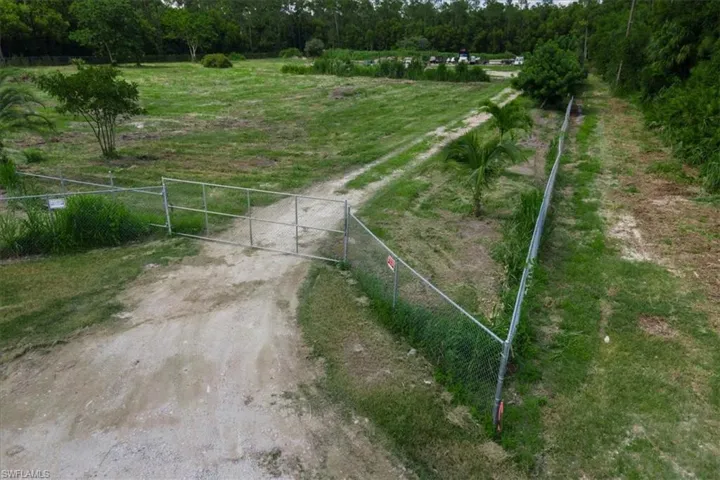 Birds eye view of property with a rural view