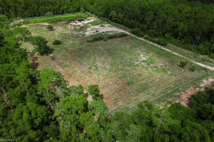 Birds eye view of property featuring a rural view