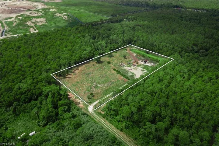 Birds eye view of property featuring a rural view
