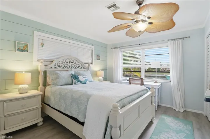 Bedroom featuring wood finished floors and ceiling fan