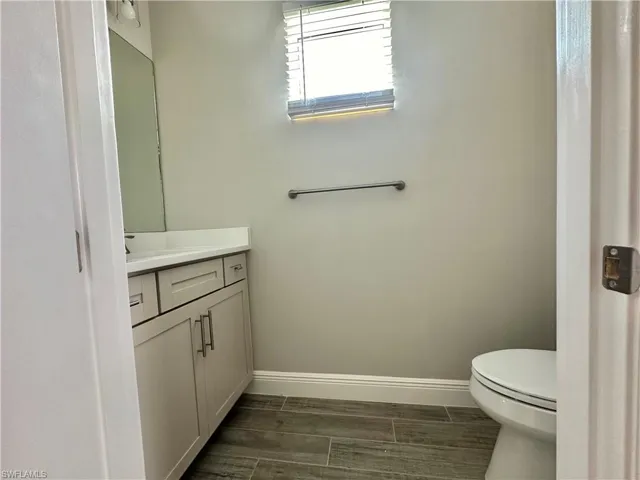 Bathroom with vanity and wood finish floors