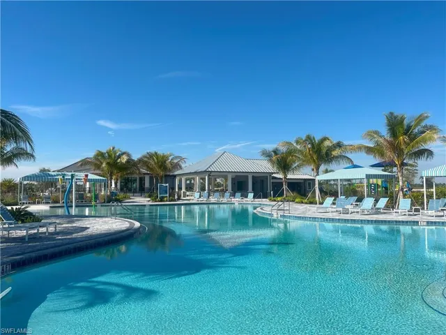 Community pool with a patio area