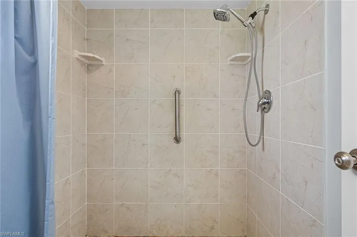 Bathroom featuring a shower with shower curtain