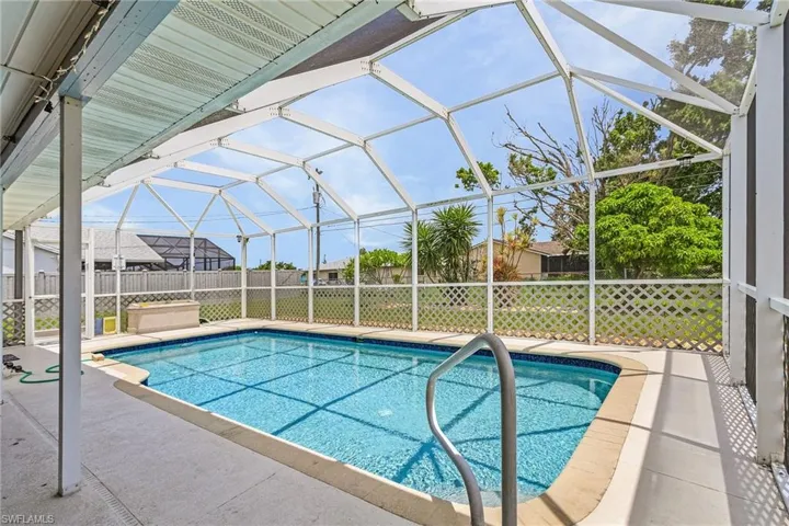 View of pool featuring a patio and a lanai