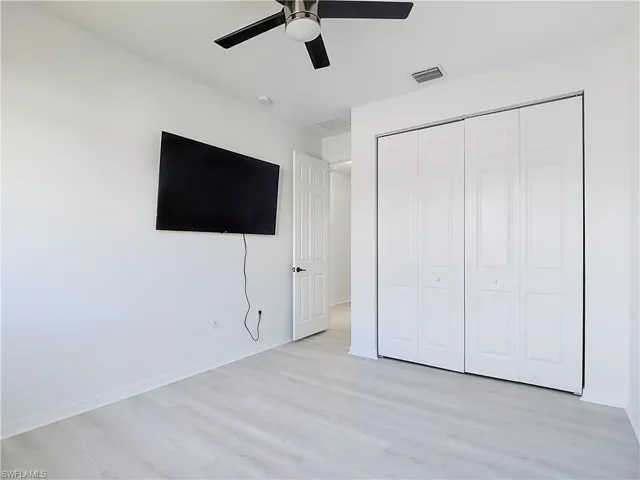 Bright interior room featuring light wood-finish flooring