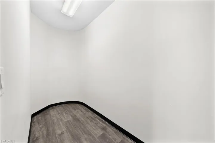 Unfurnished room featuring hardwood / wood-style floors