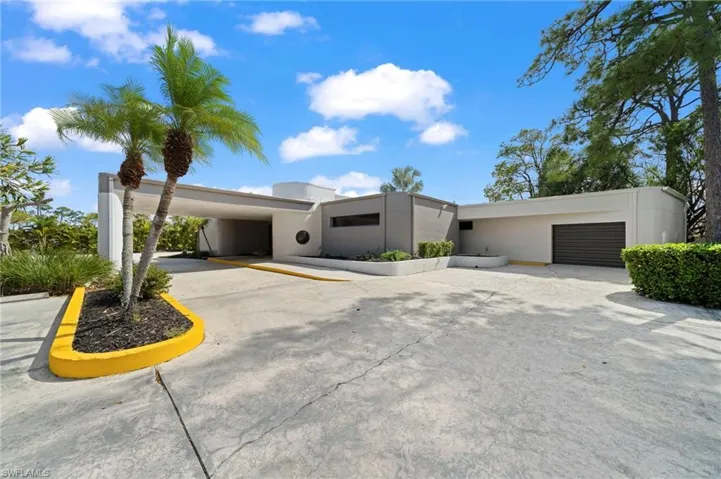 View of front of home featuring a carport