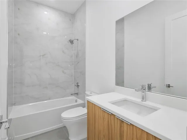 Full bath with vanity and shower / bathtub combination