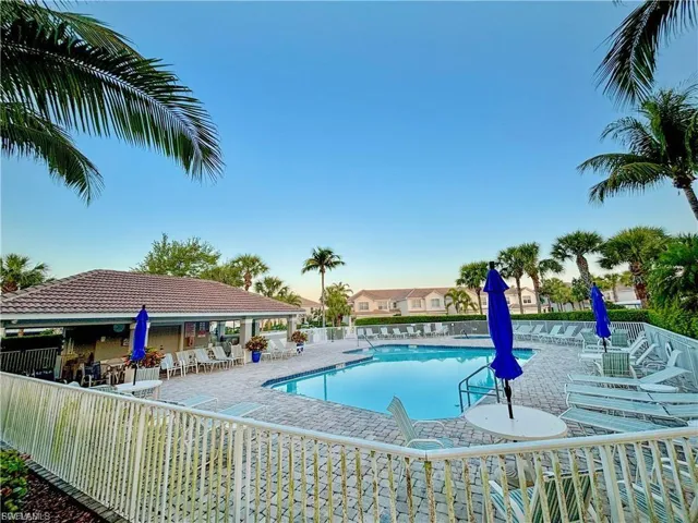 Community pool with a patio area.