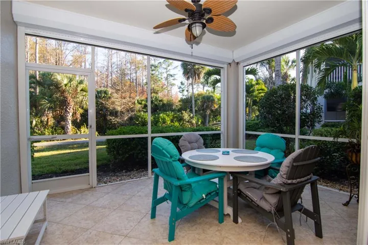 Large tiled and fully screened lanai with direct access to the outdoors; motorized storm shutters; a ceiling fan and a table with 4 comfortable chairs.