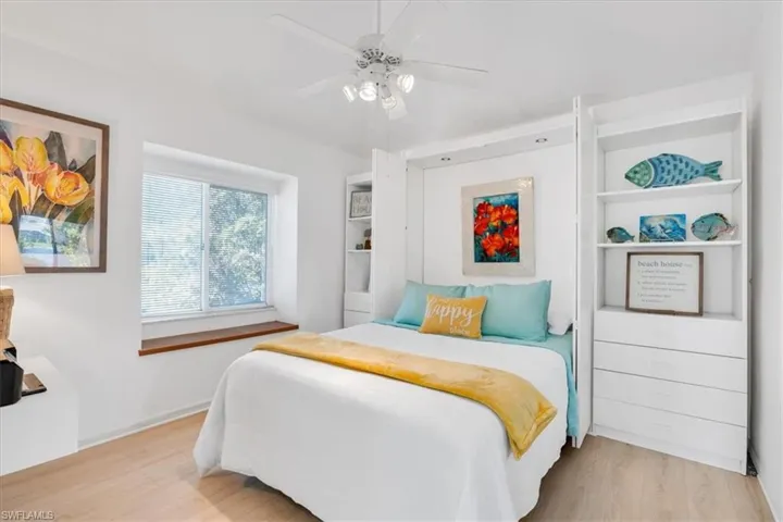 Bedroom featuring light wood-type flooring and ceiling fan