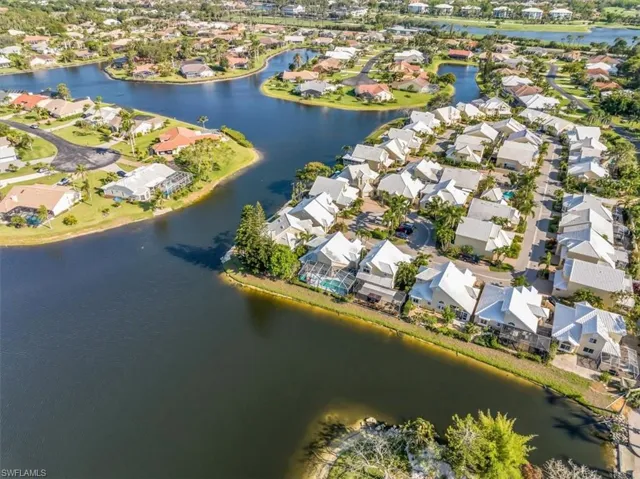 Aerial overview of property's location with a large body of water and nearby suburban area