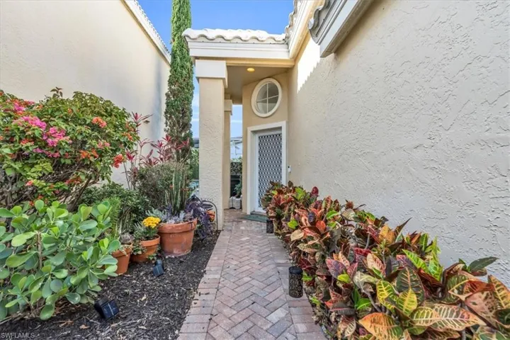 Property entrance with stucco siding