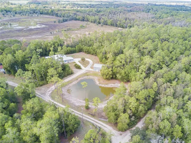 Aerial overview of property's location with a nearby body of water