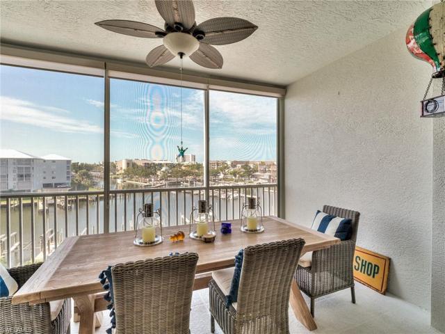 Screened and glassed-in lanai facing intersecting canals.