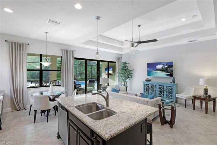Kitchen includes cafe area as well as kitchen island for quick meals.