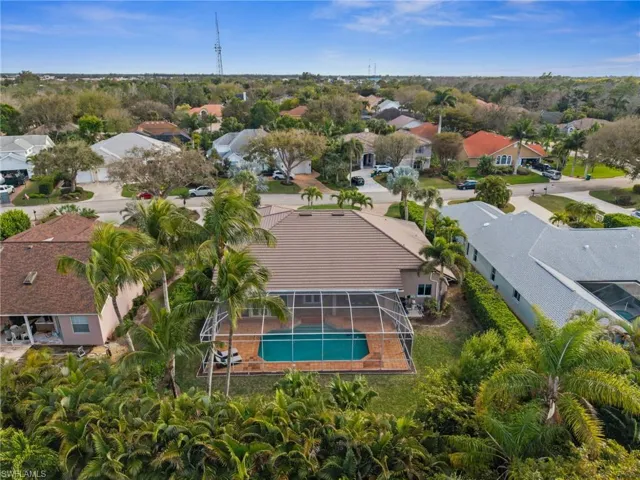 Aerial perspective of suburban area featuring a pool area