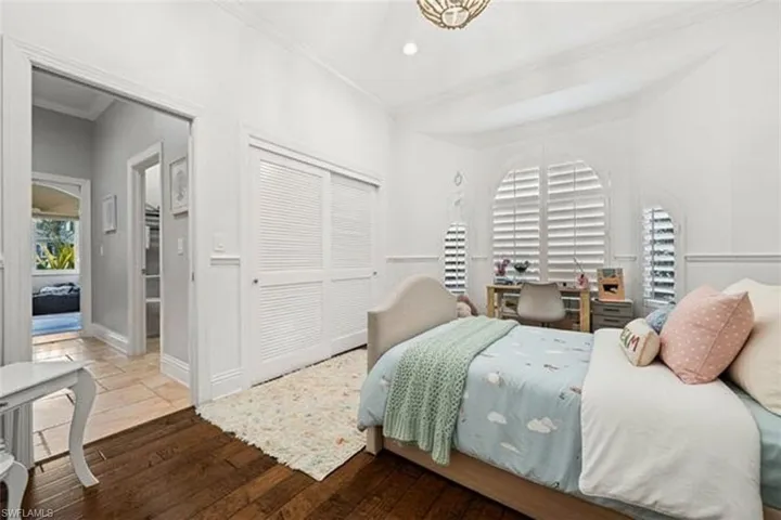 Bedroom featuring hardwood / wood-style floors, a closet, and recessed lighting