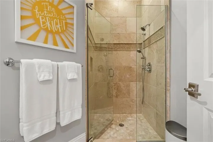 Full bath featuring a shower stall