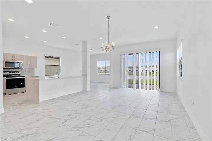 Living room featuring tile  flooring, and recessed lighting.