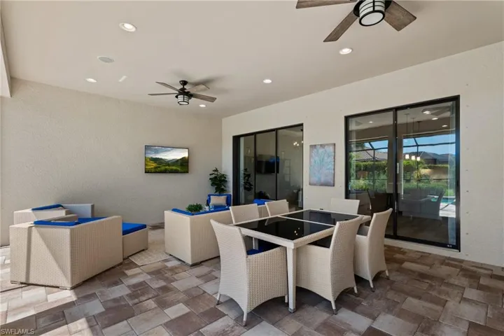 View of patio / terrace with a ceiling fan and outdoor dining space