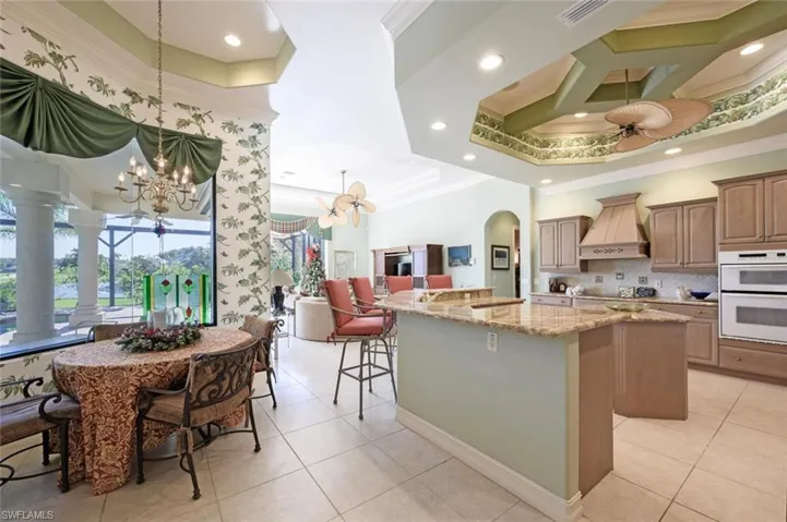 Open concept eat-in kitchen with breakfast bar