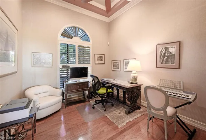 A separate office space with hardwood floors