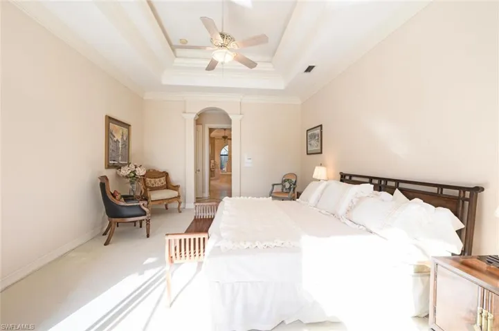 The primary bedroom with tray ceiling