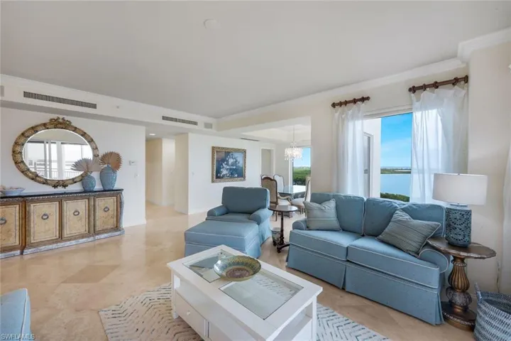 The decor of the living room provides a relaxing coastal vibe.