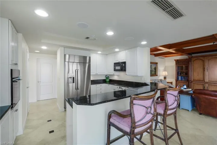 The kitchen, the heart of the home, is centrally located between the living/dining area and the family room.