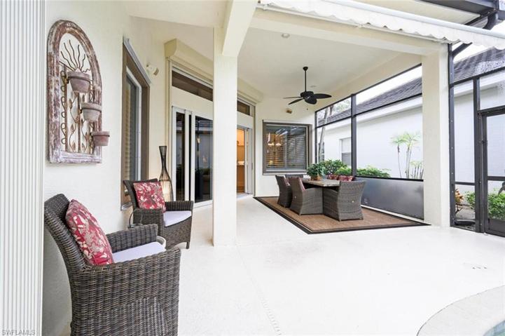Spacious under cover area for dining or lounging area with an electric awning for extra coverage and shade