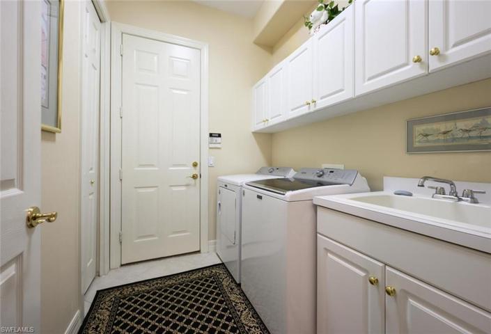 Laundry Room with Tub Sink, Cabinet Storage, Storage Closet and access to the 2 car garage