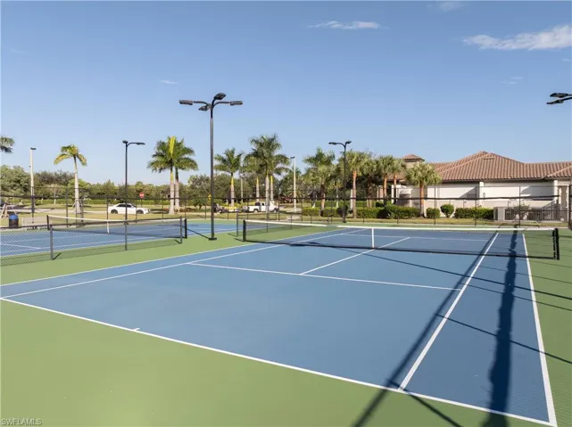 View of tennis court with community basketball court