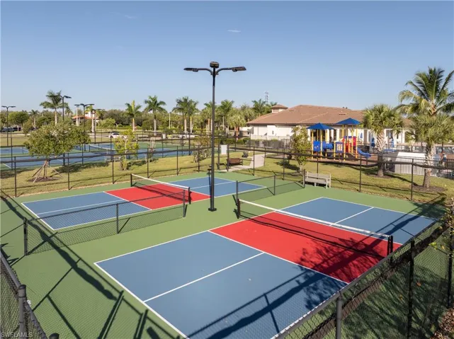 View of tennis court featuring community basketball court