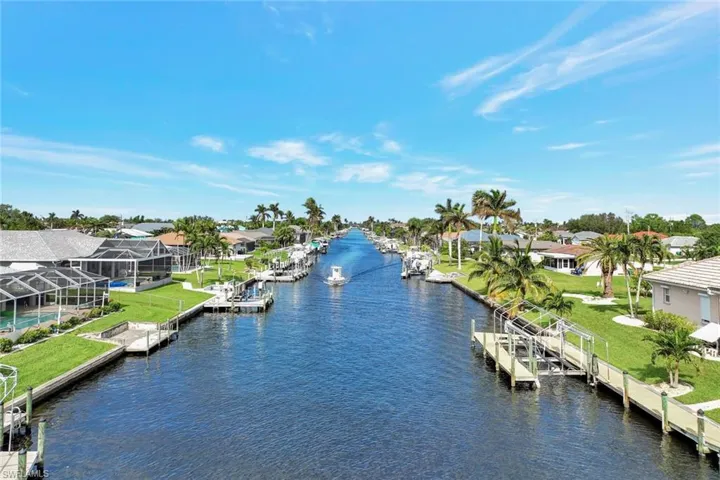 View of water feature with a dock