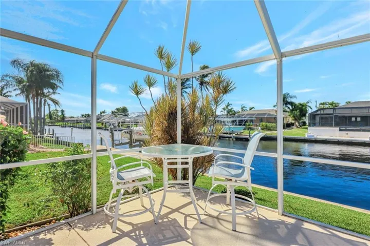 Unfurnished sunroom featuring a water view