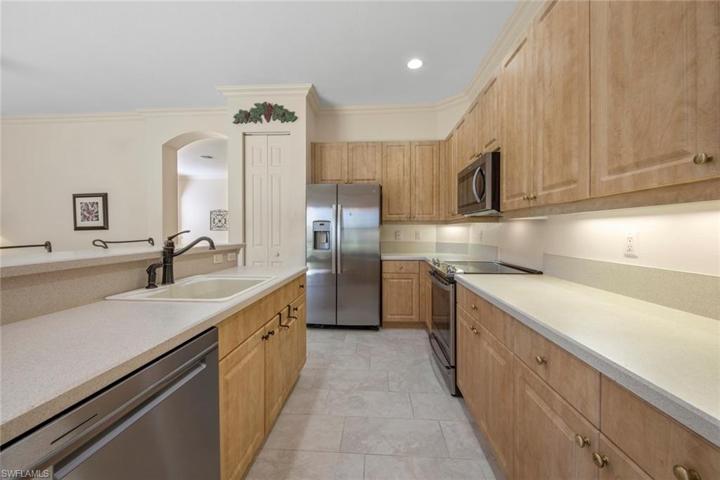 Plenty of cabinets and counter space.  Pantry to left of refrigerator