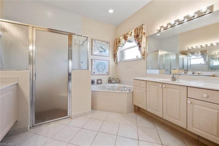 Dual vanities, step in shower, large soaking tub
